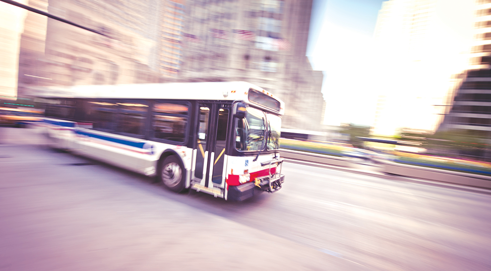 Bus driving down the street